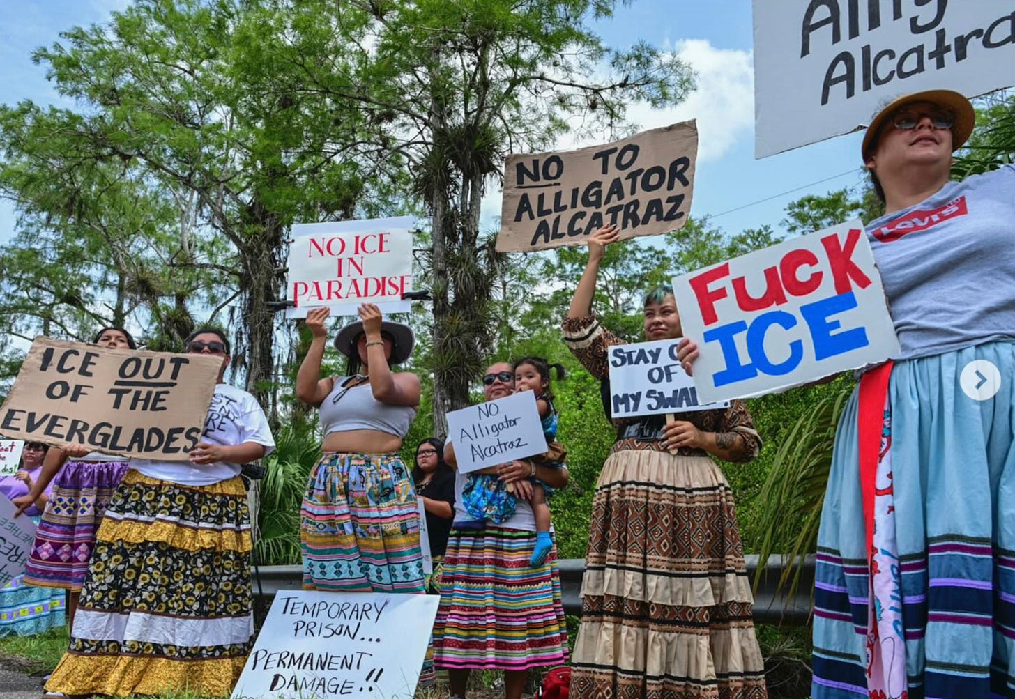 Women wearing traditional Seminole/Micosukee dress, protesting ICE facility