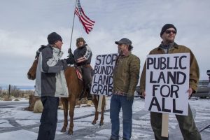 Counter protestors standing in snow at Bundy standoff in Malheur Refuge